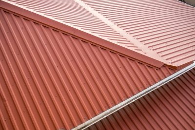 Roof of the house with metal corrugated panels