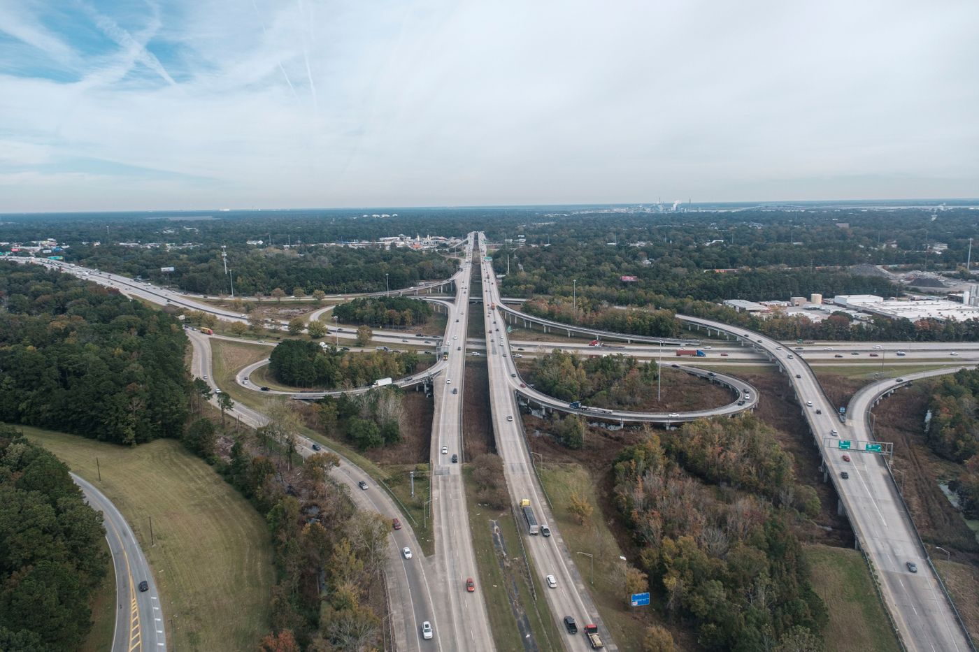 Aerial view of a highway interchange among trees