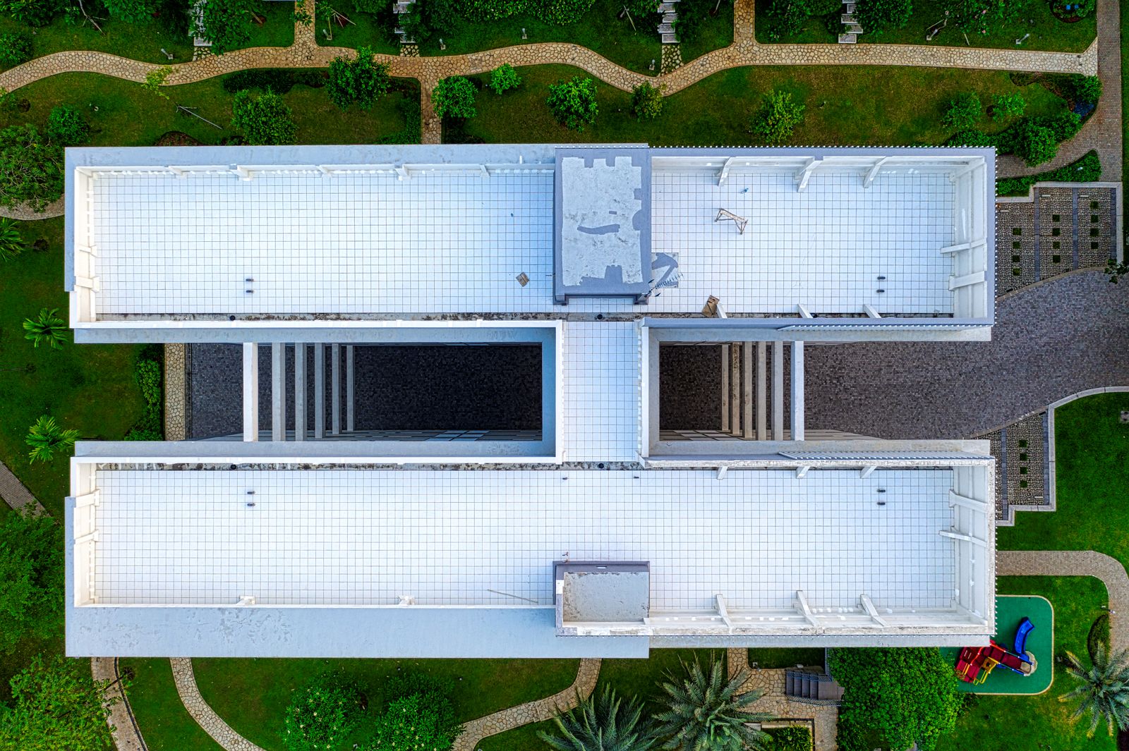 Aerial view of a white flat roof on a large building
