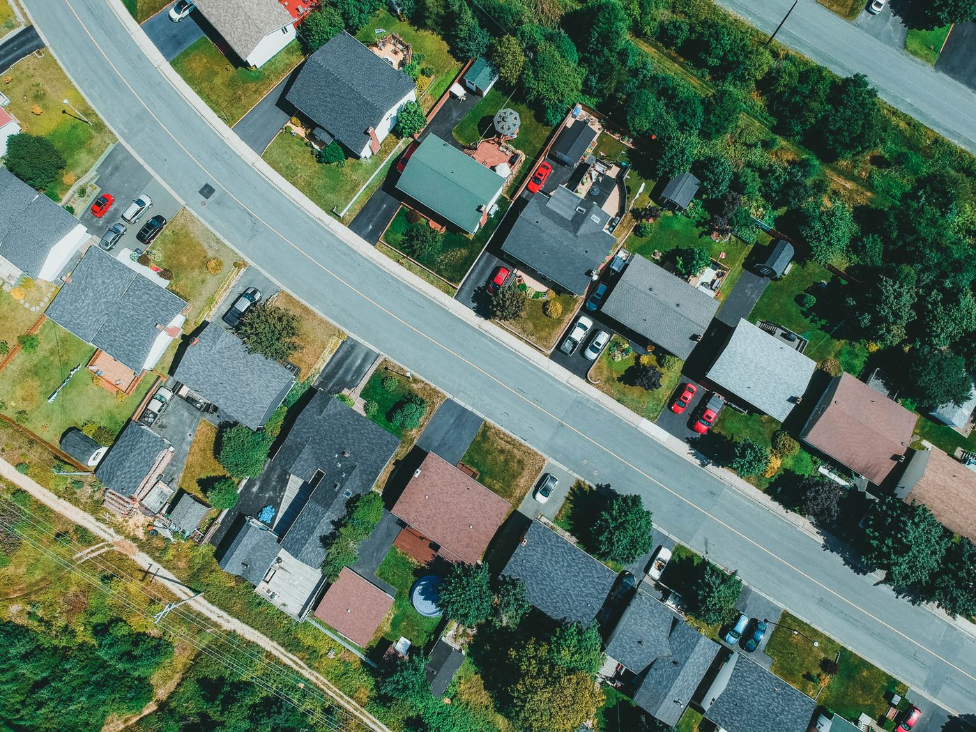 Aerial view of houses along a curving street