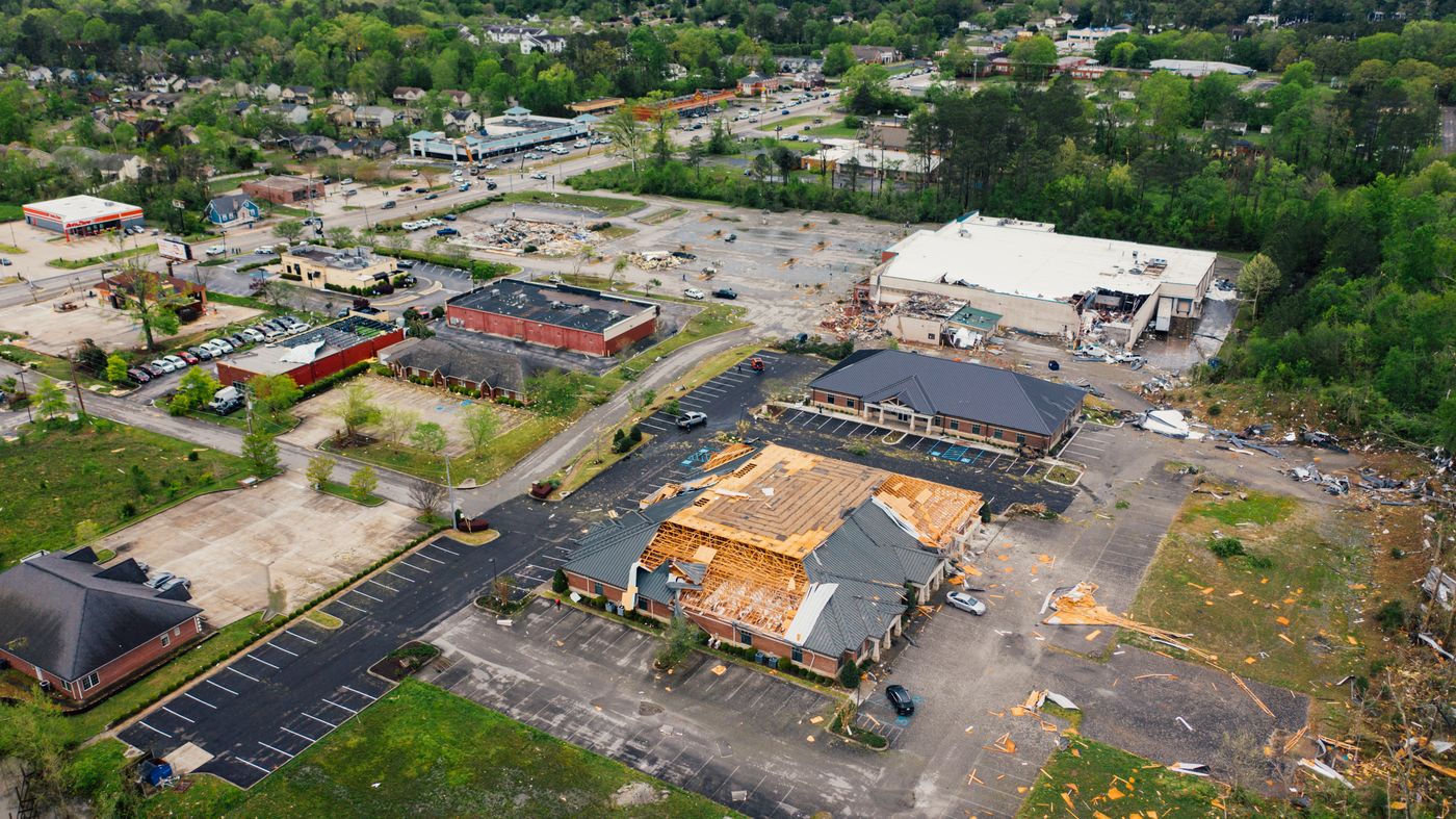Aerial view of storm-damaged commercial roofs