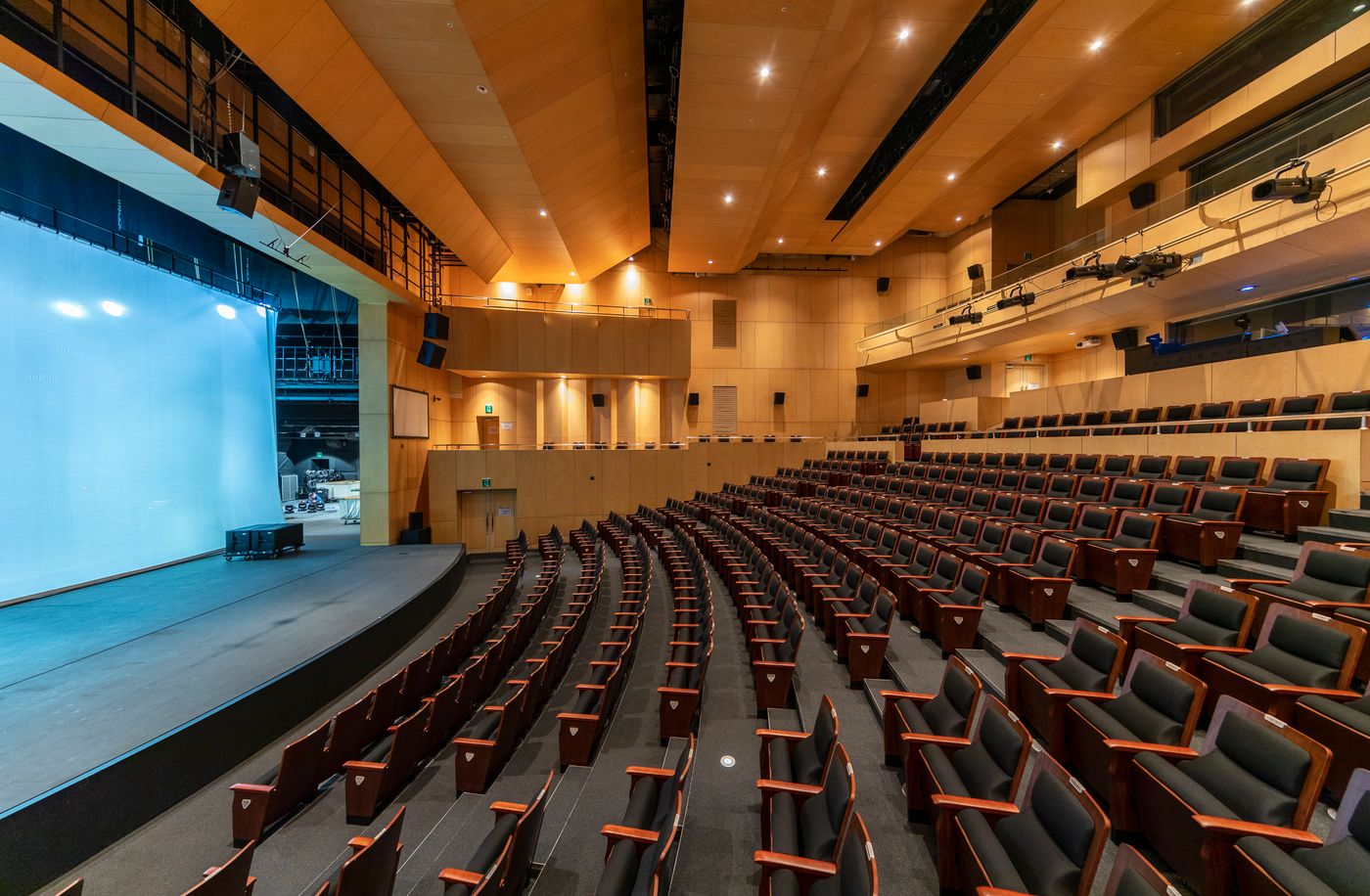 Auditorium with rows of seats facing a stage
