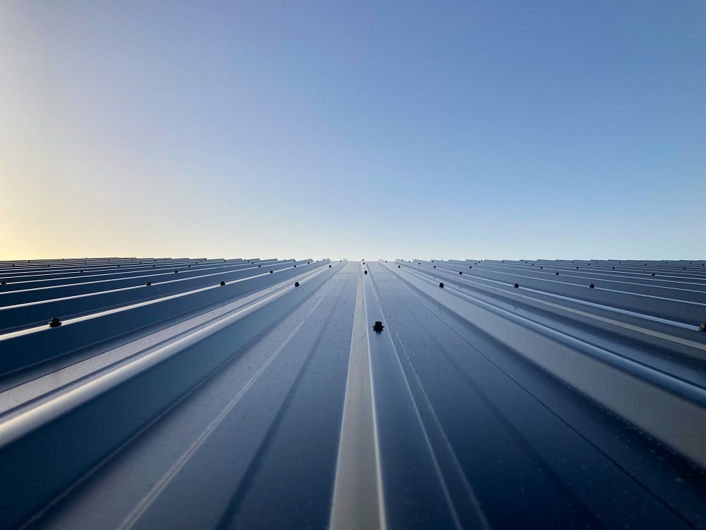 View of dusk from above the roof