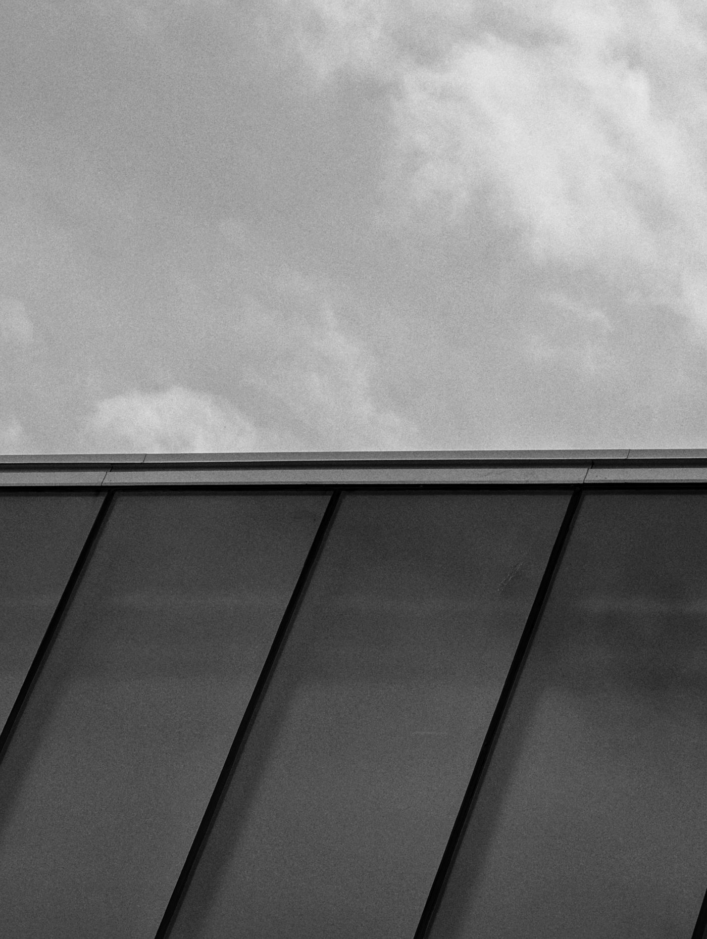 Close view of dark standing seam panels