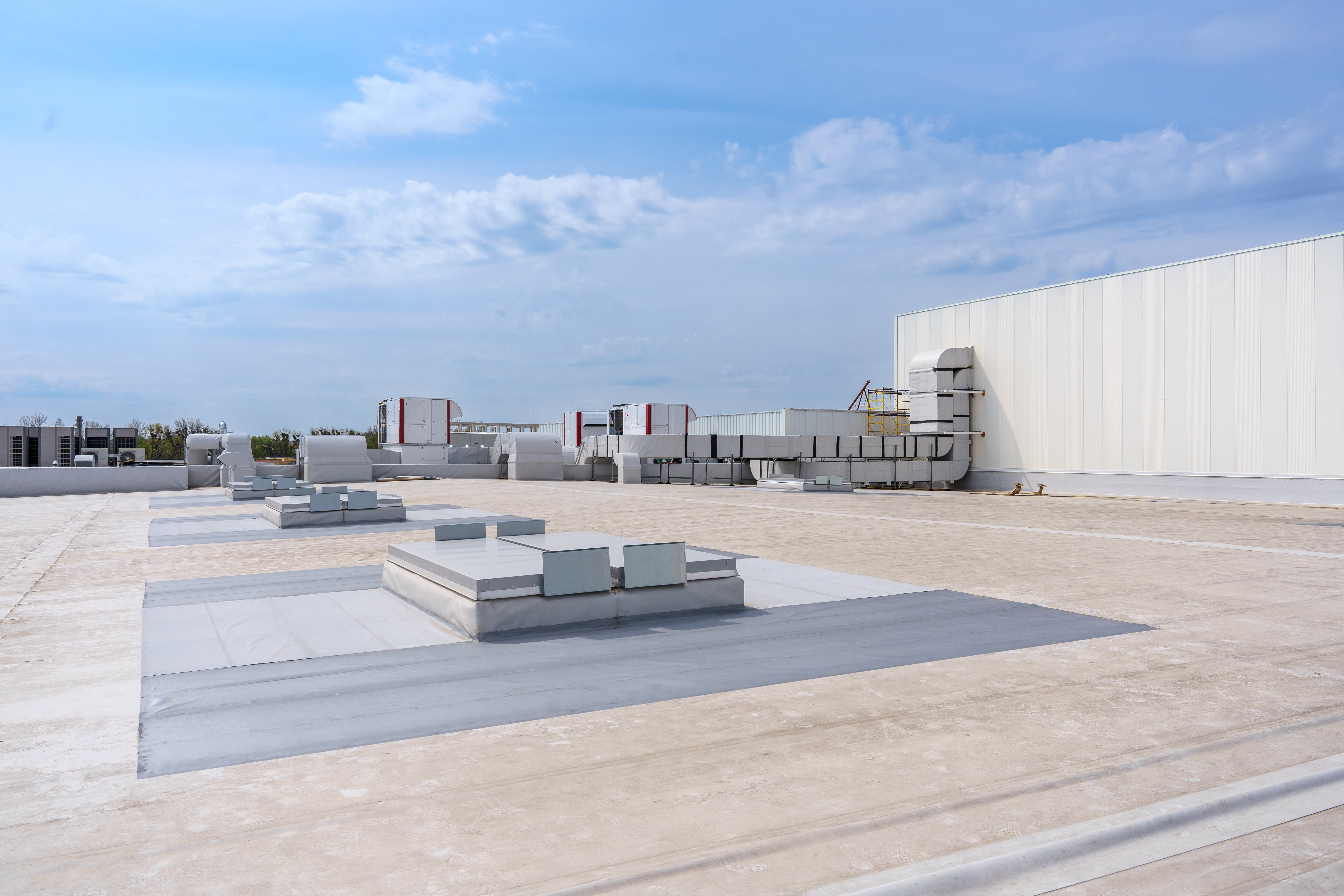 Flat commercial roof with rooftop units