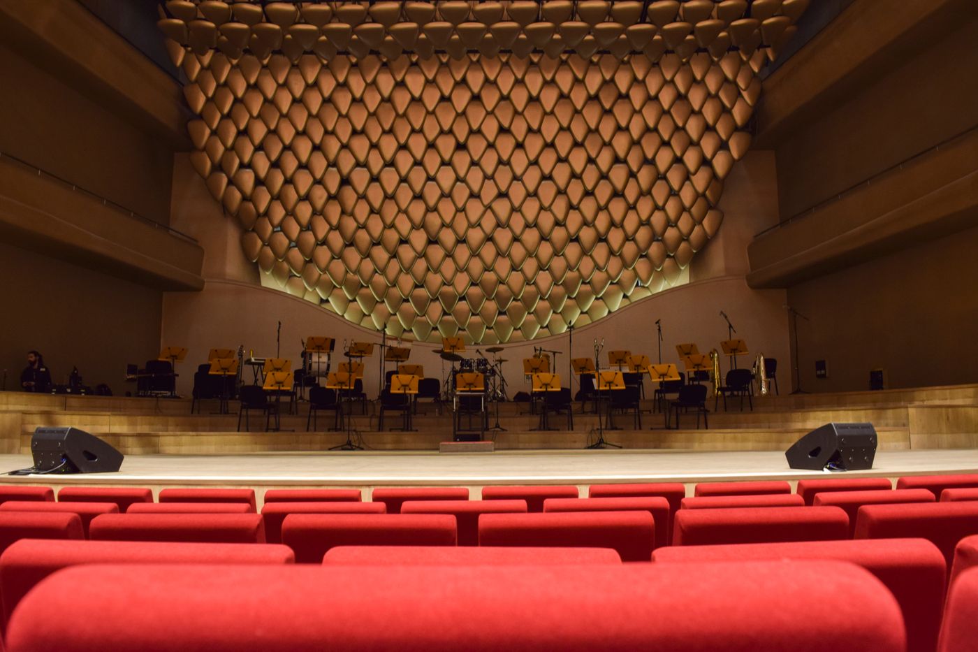 Concert hall with rows of red seats