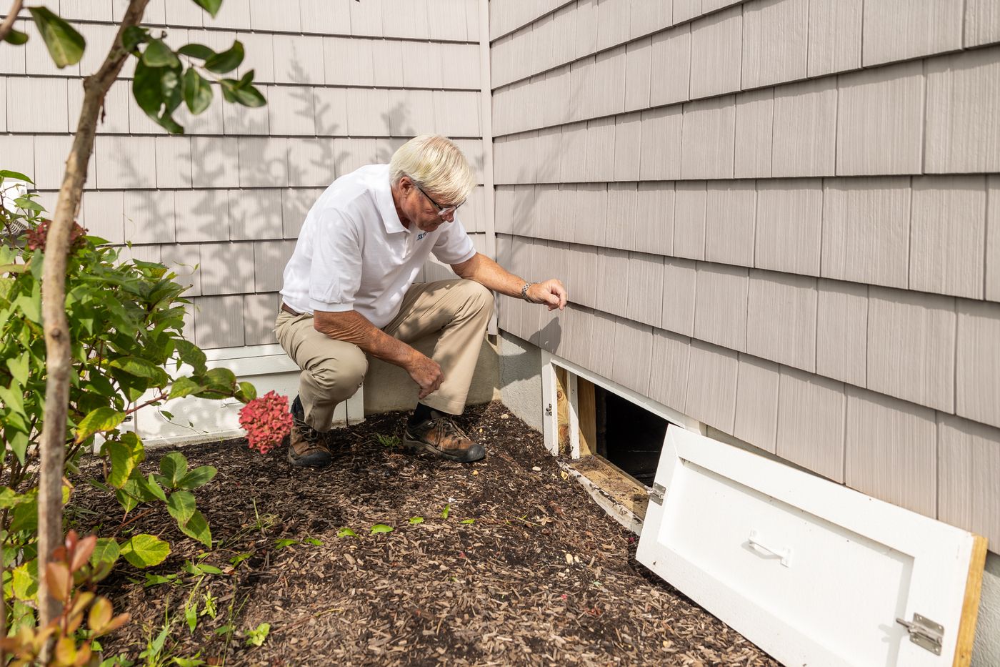 Contractor checking the exterior of a house