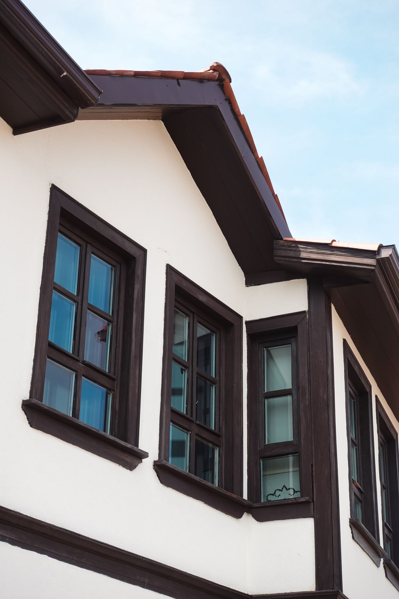 Dark eaves and trim on a white house