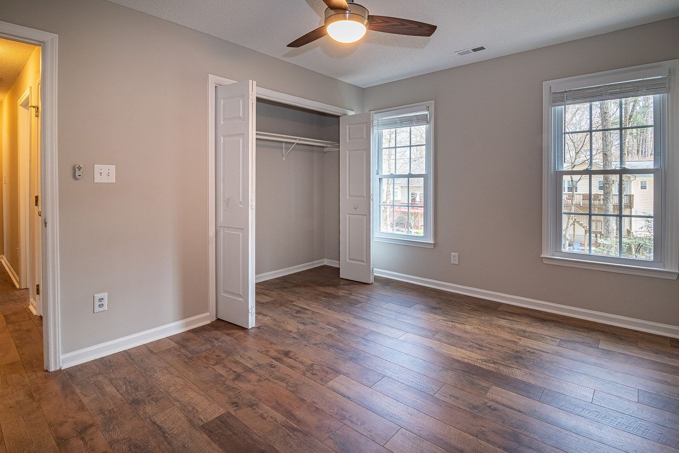 Empty bedroom with a ceiling fan