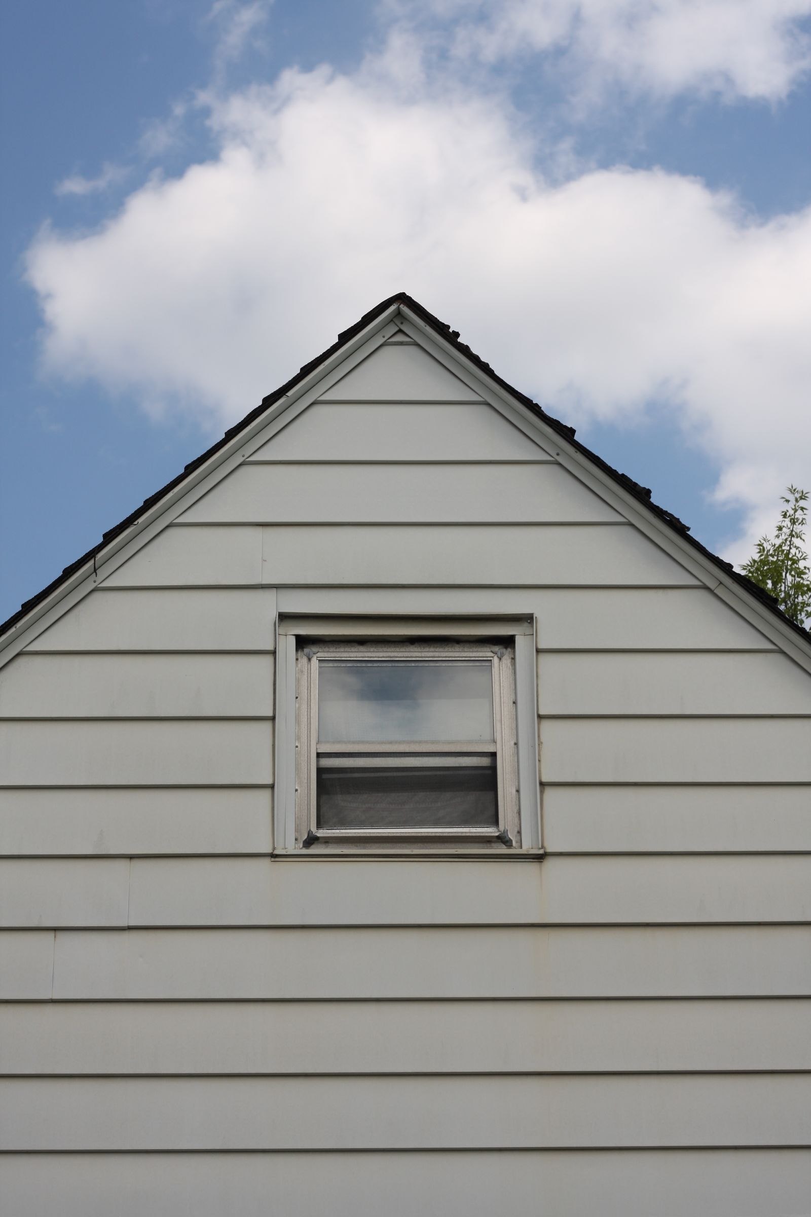 Gray lap siding on a house gable