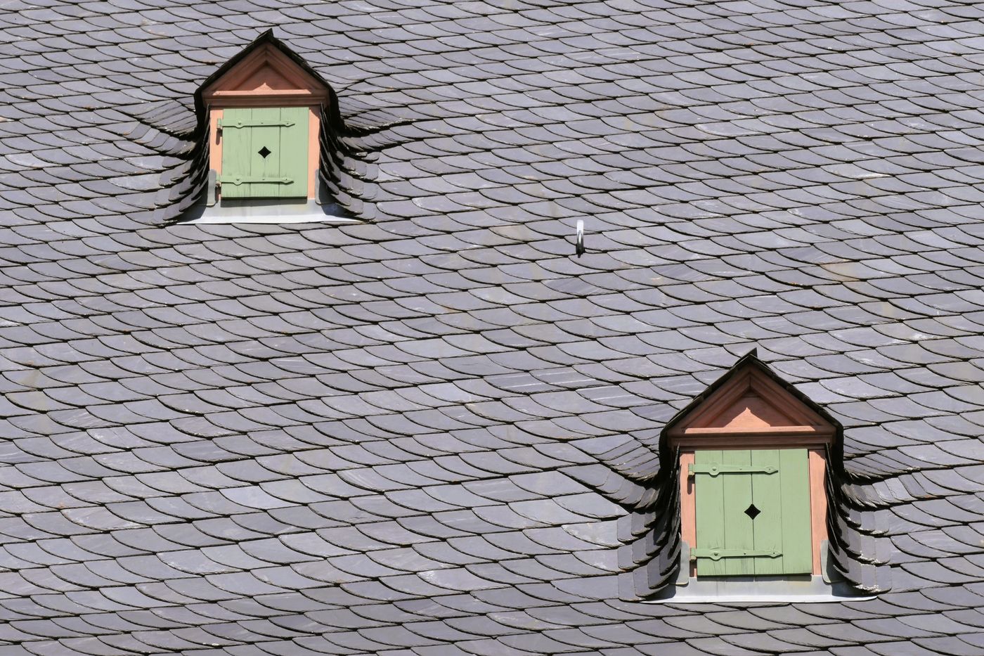 Gray slate roof with two small dormers