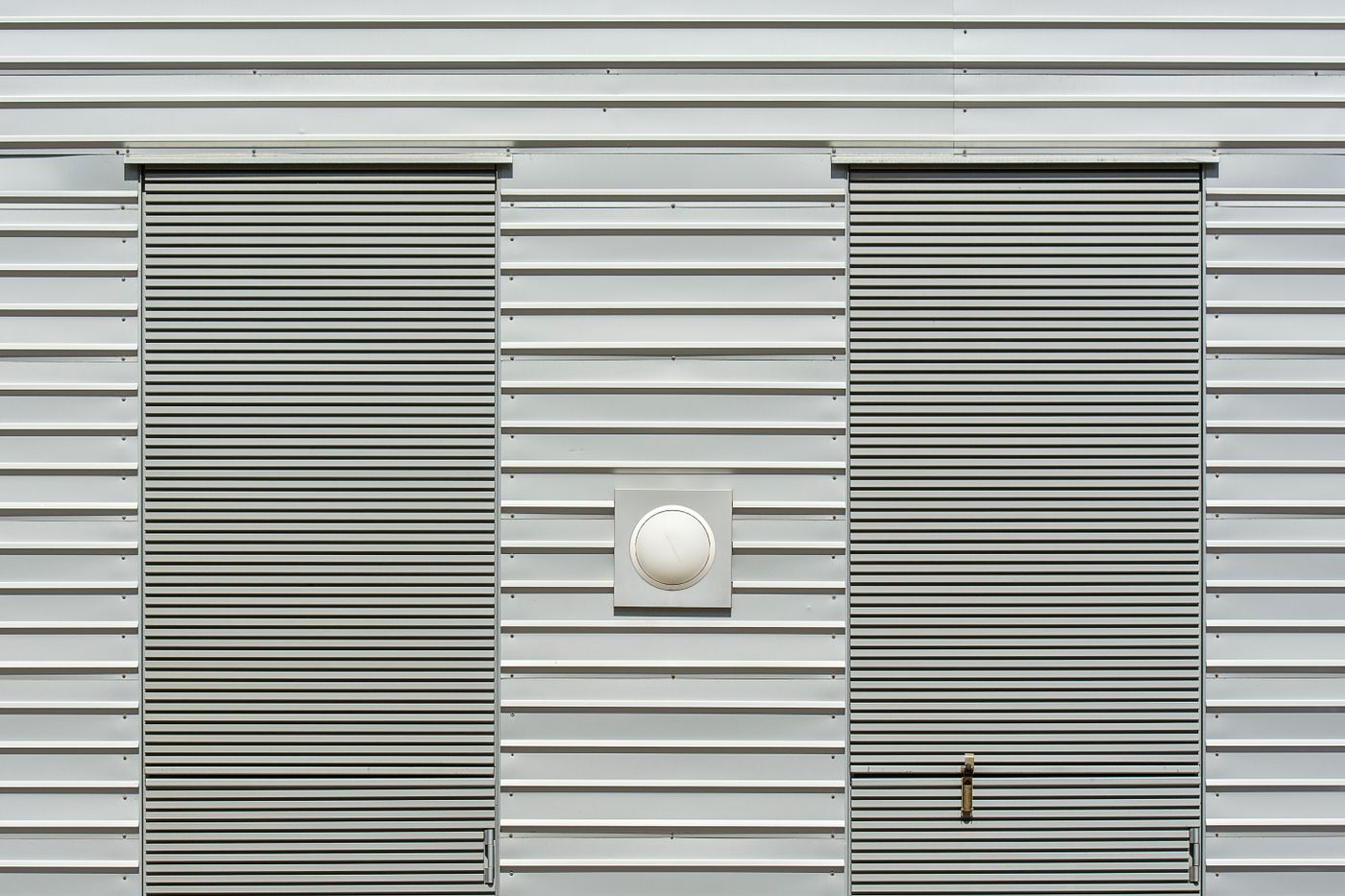 Industrial building with metal siding and roller doors