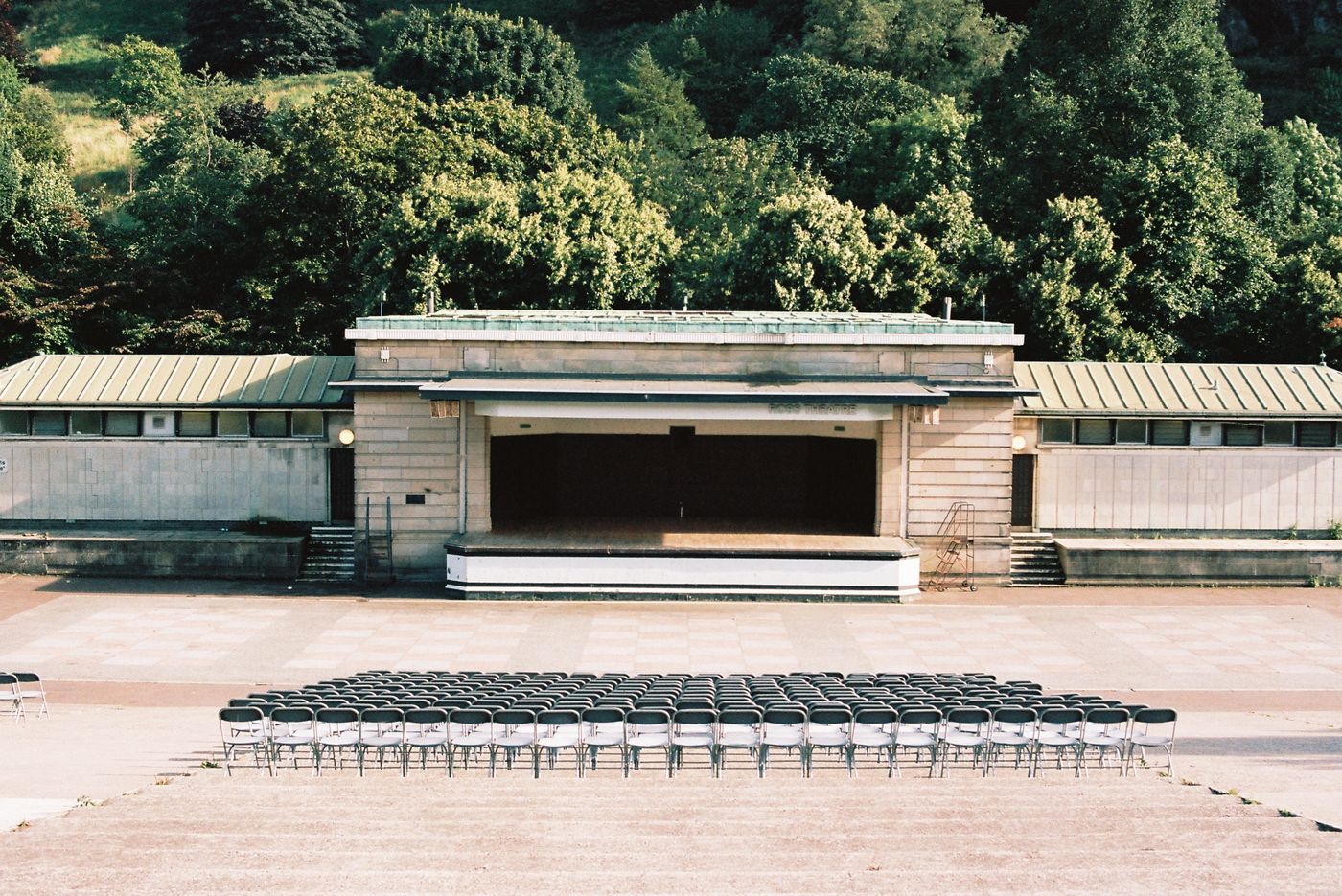 Outdoor stage with rows of chairs in front