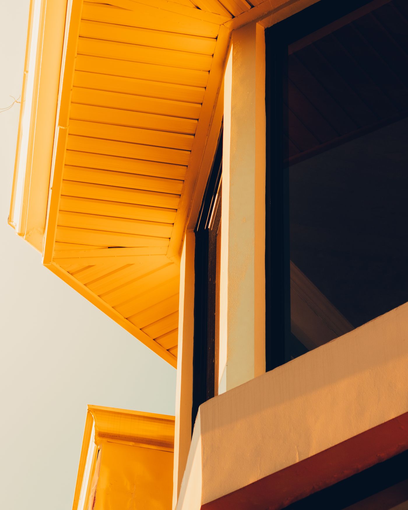 Painted soffit boards under a roof overhang