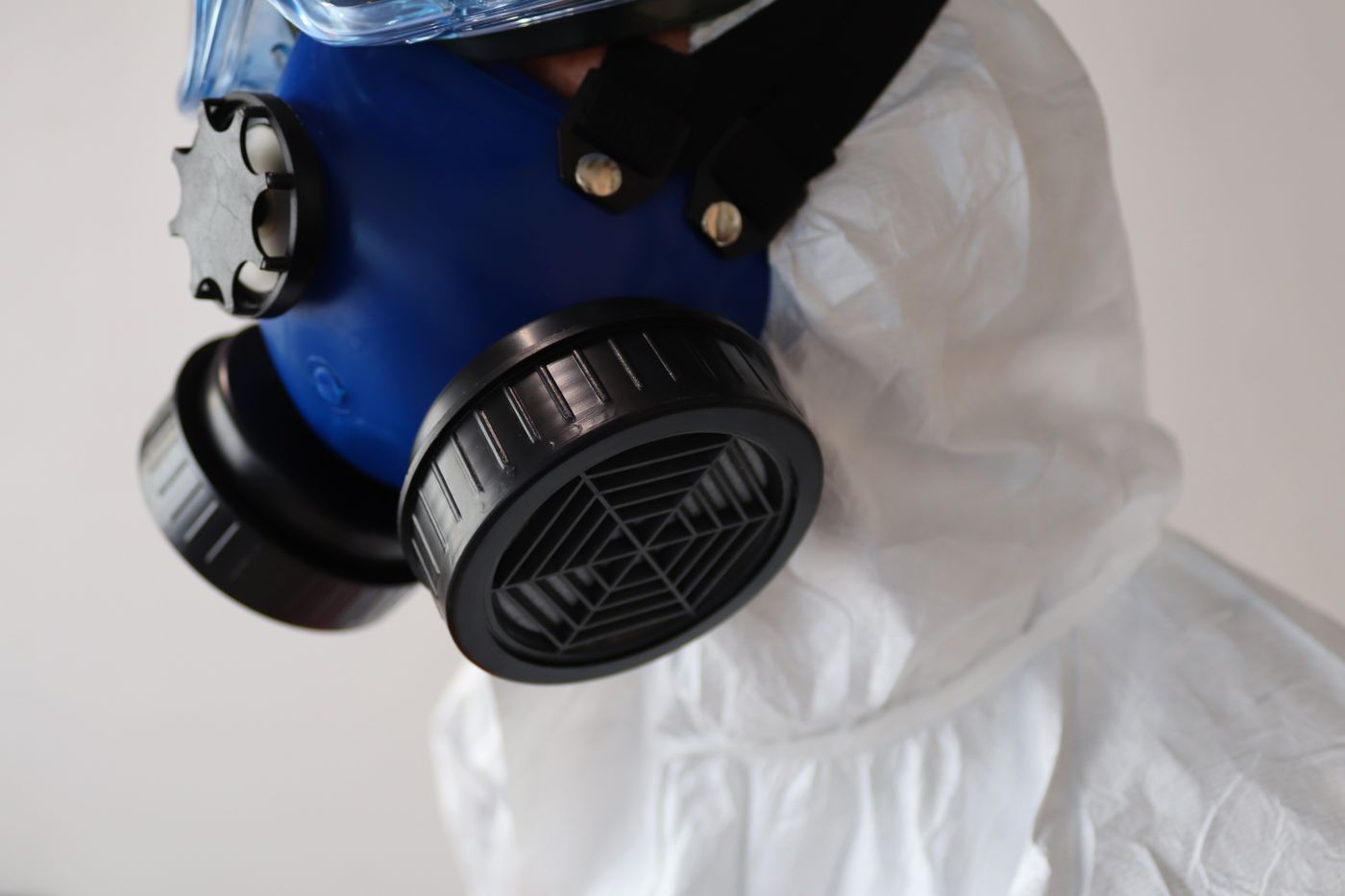 Respirator and protective suit for handling asbestos