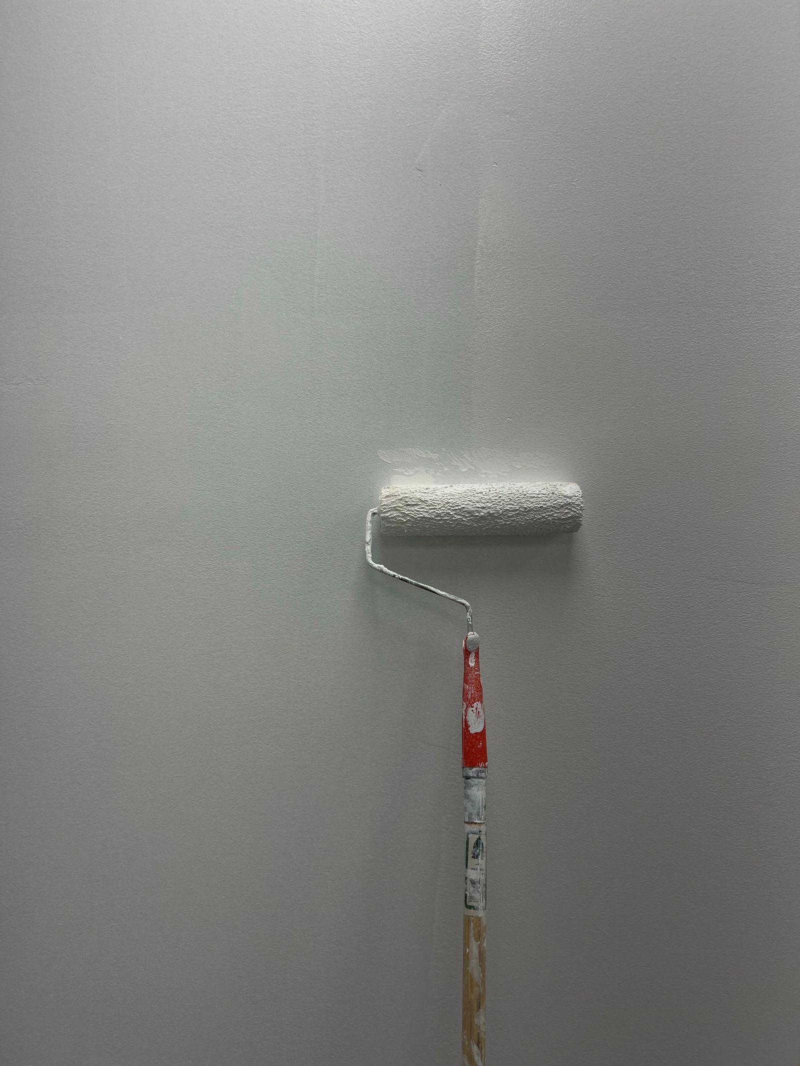 Applying a light-colored protective coating with a roller