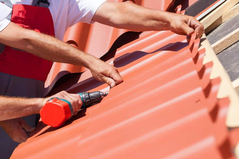 Roofers at work on a house roof