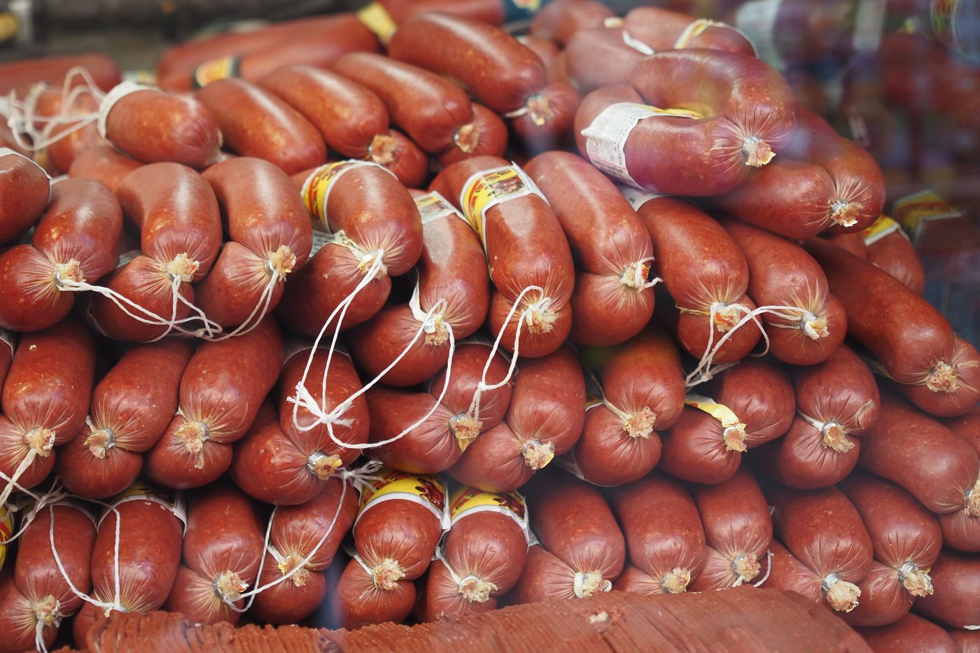 Rows of smoked sausages tied with string