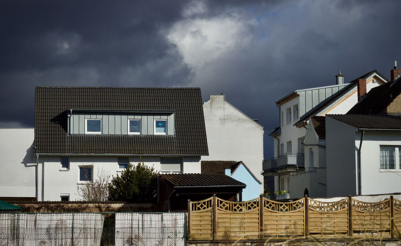 Storm clouds over houses on a residential street