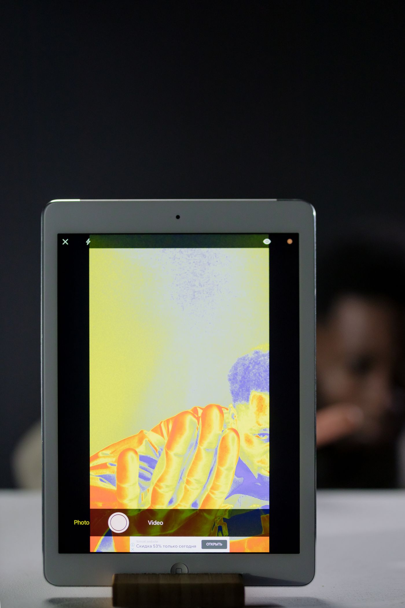 Tablet screen showing a thermal camera image