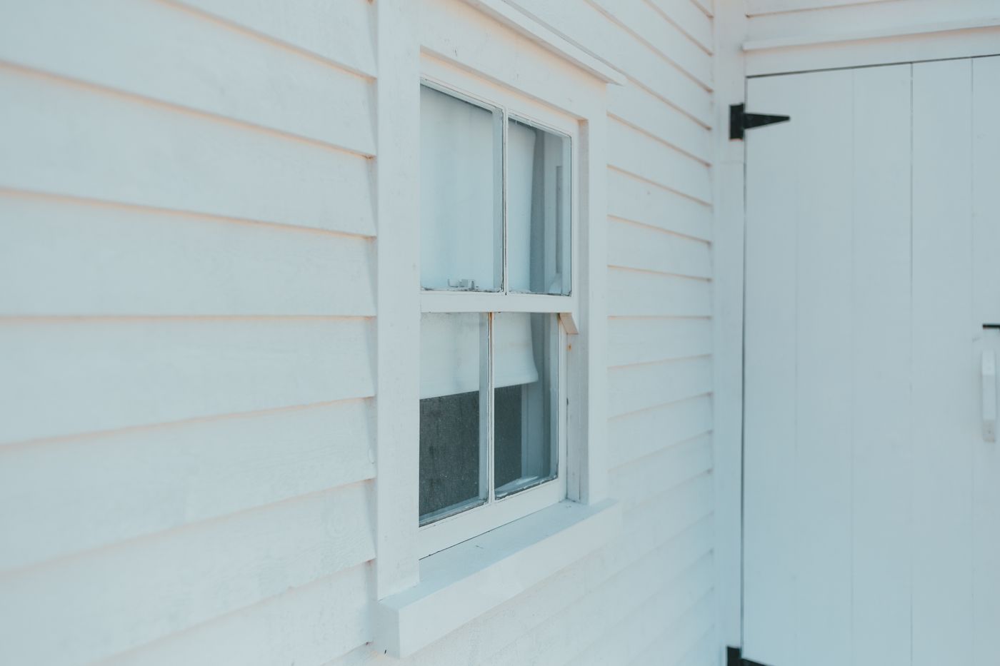 White lap siding around a window