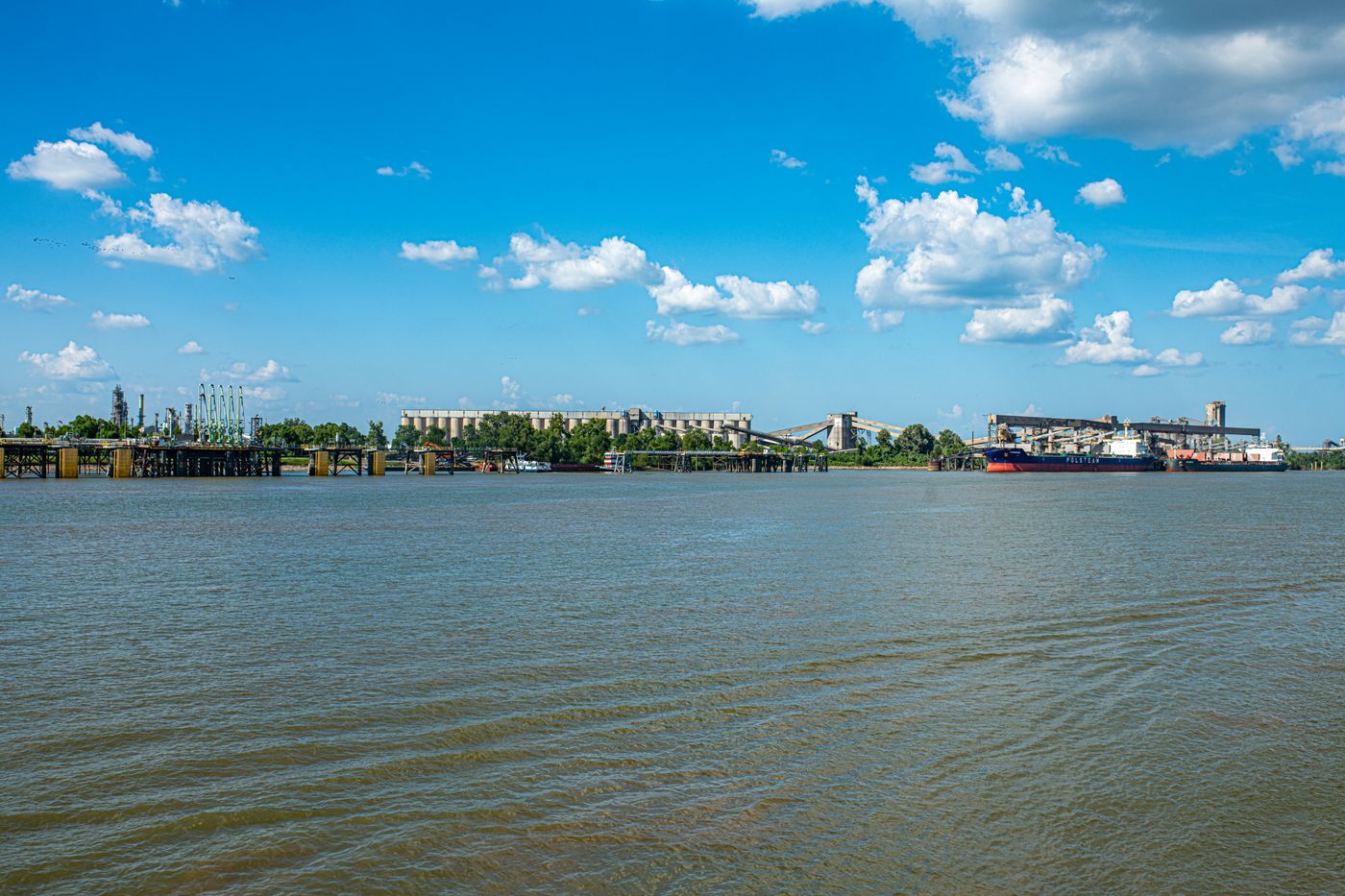 Wide river with a ship and a distant shoreline