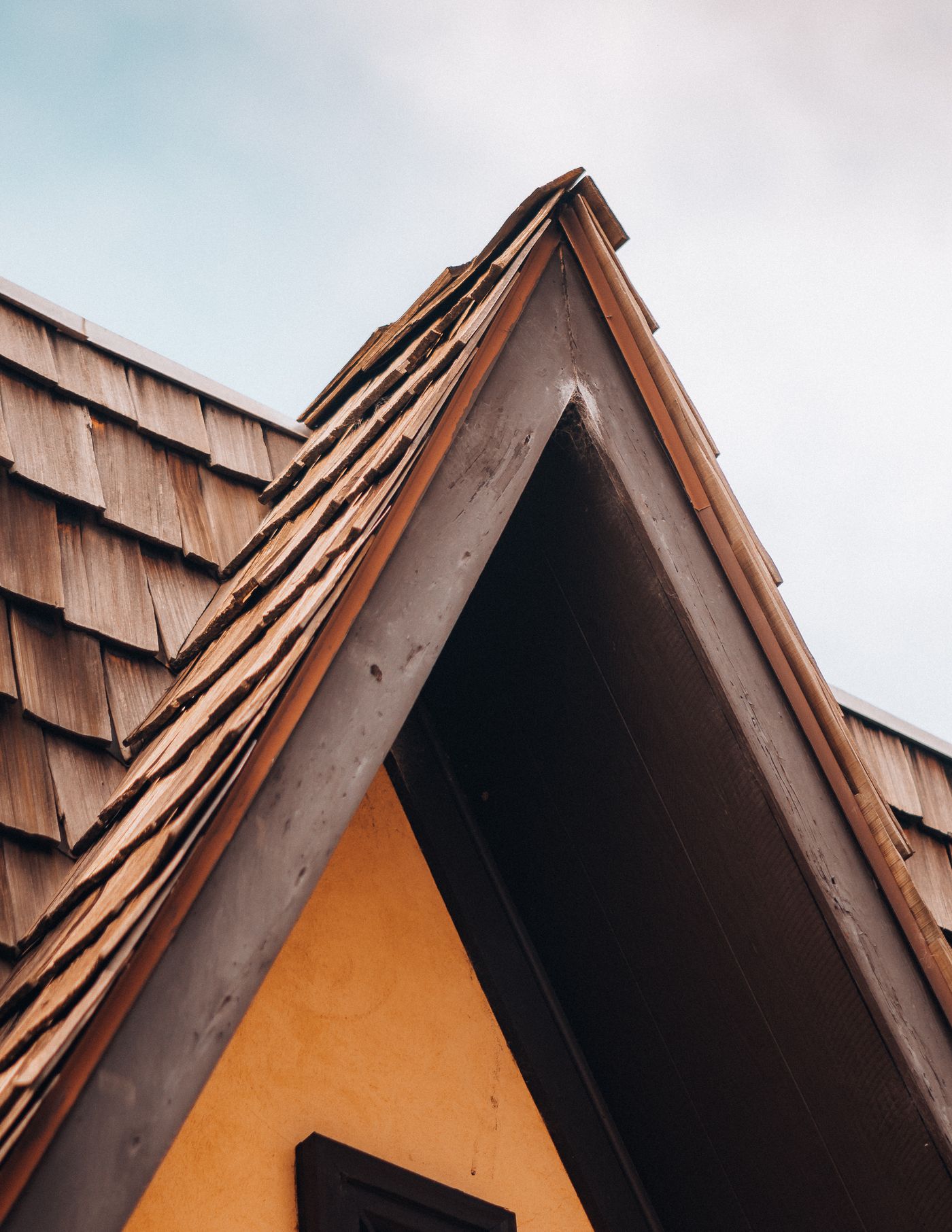 Wood shake shingles along a roof gable