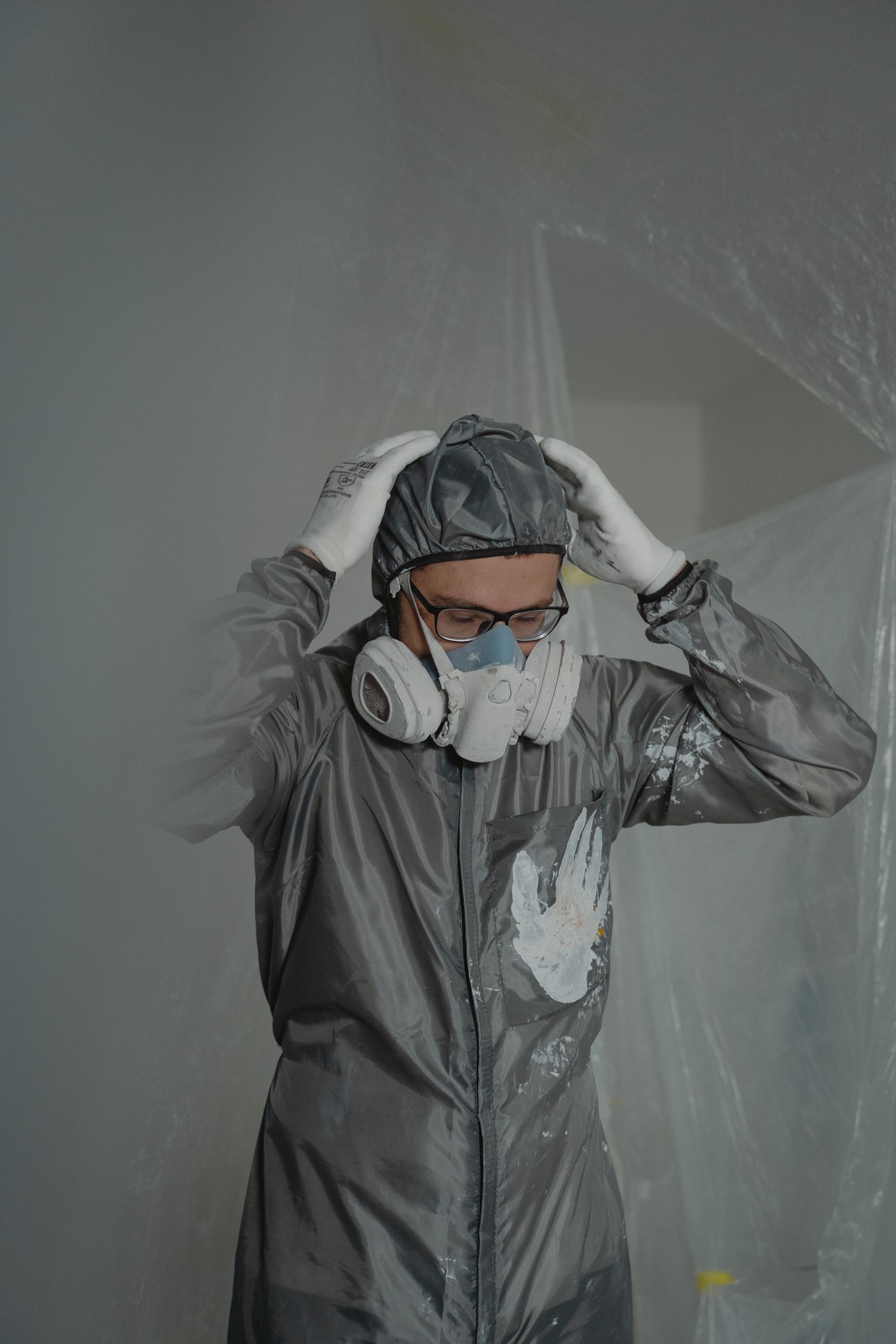 Worker in a protective suit and respirator